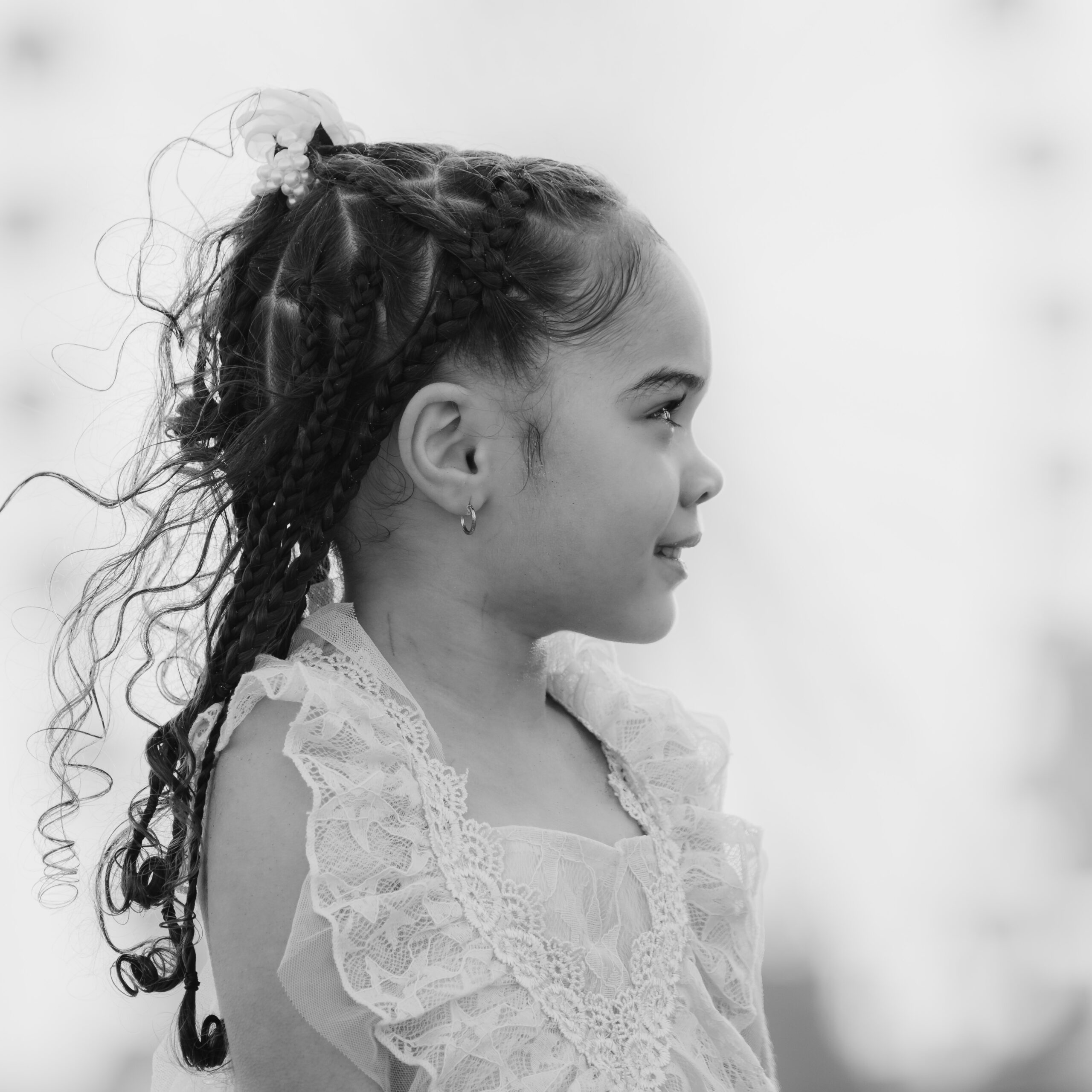 a young girl with braids in her hair