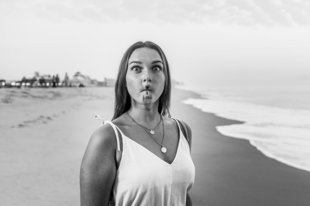 a woman making a funny face on the beach