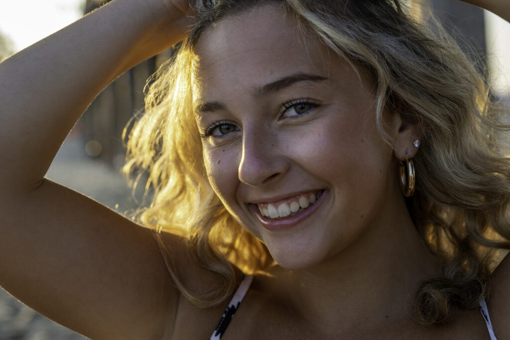 a woman in a bikini smiling for the camera