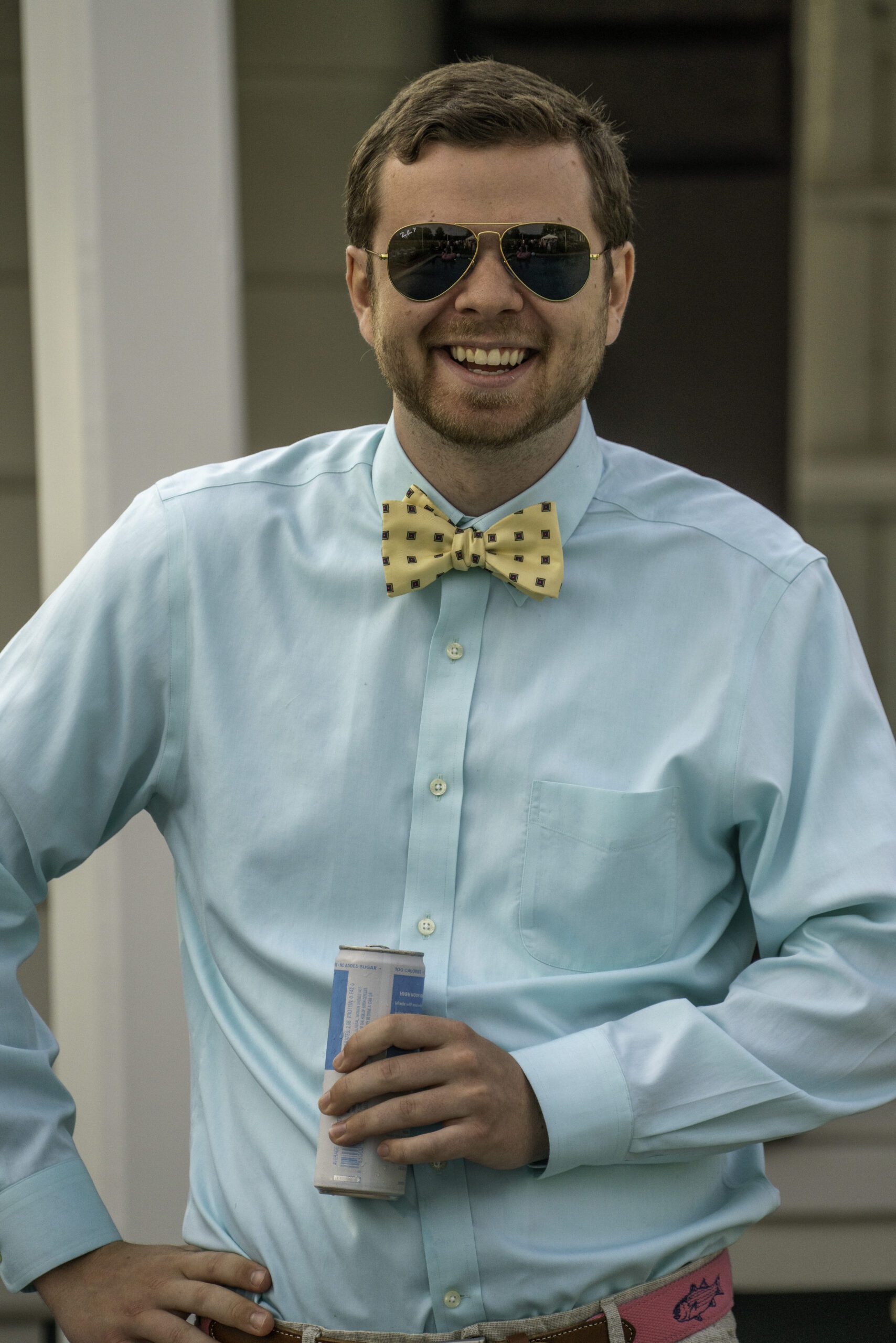 a man wearing a bow tie and sunglasses