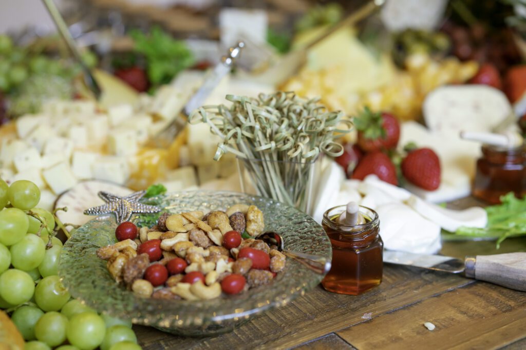 grapes, nuts, and other food items on a table