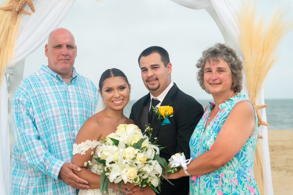 a man and two women standing next to each other