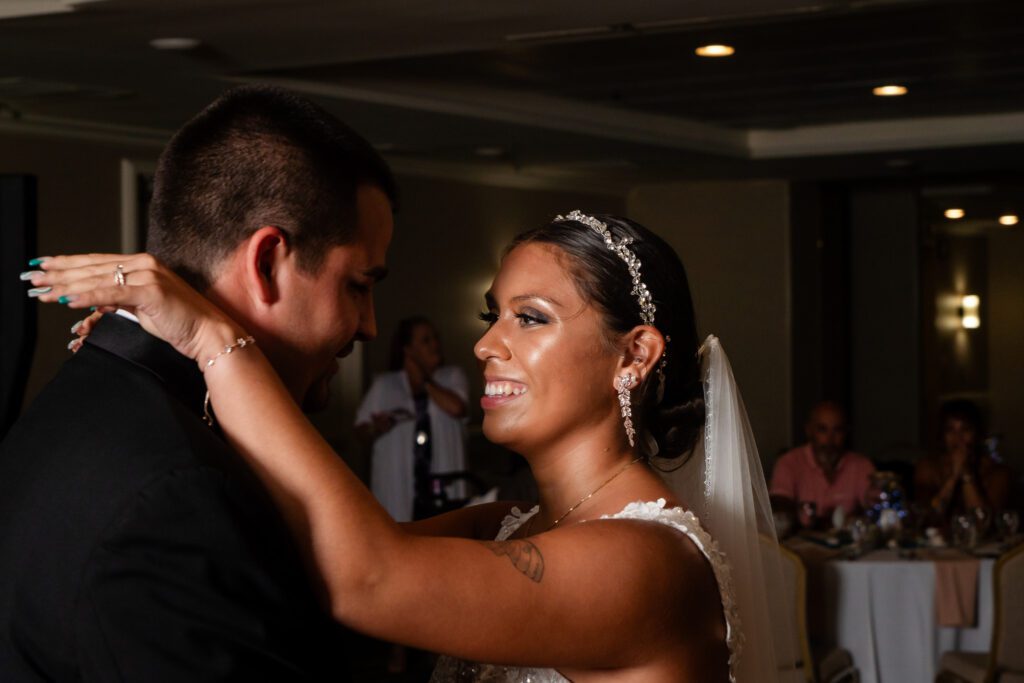 a bride and groom dance together at their wedding reception