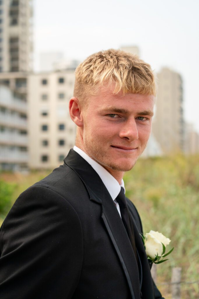 a man in a suit and tie posing for a picture