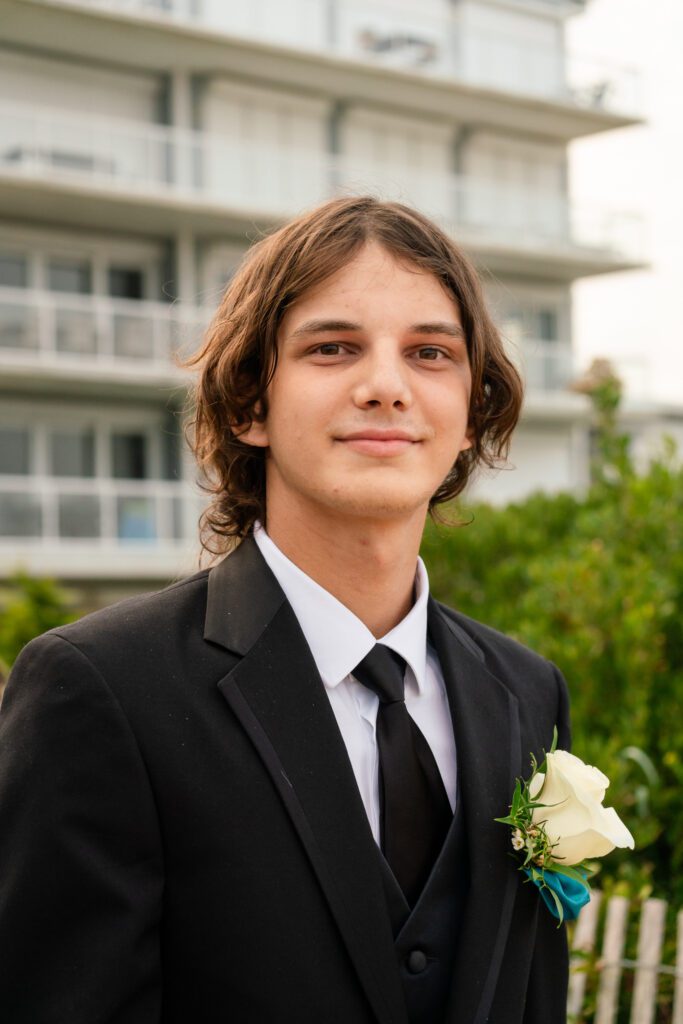 a young man in a suit and tie