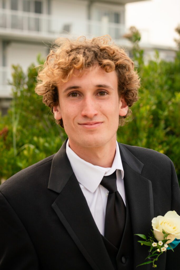 a young man in a suit and tie