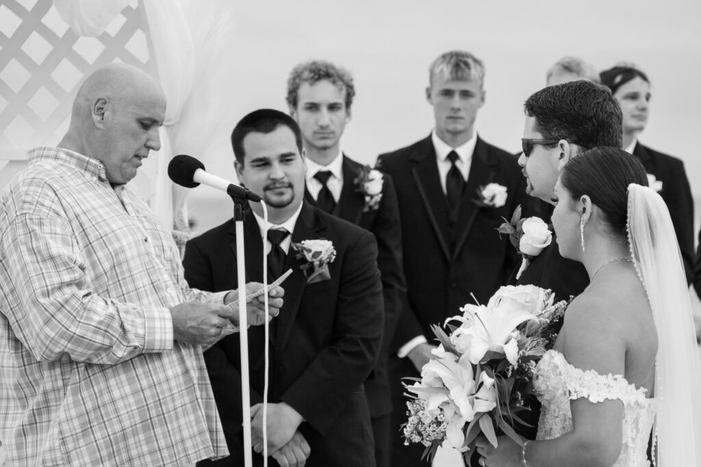 a bride and groom are standing at the alter
