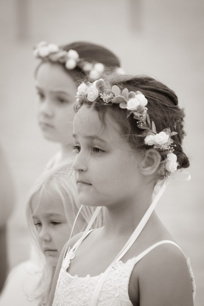 two little girls with flower crowns on their heads
