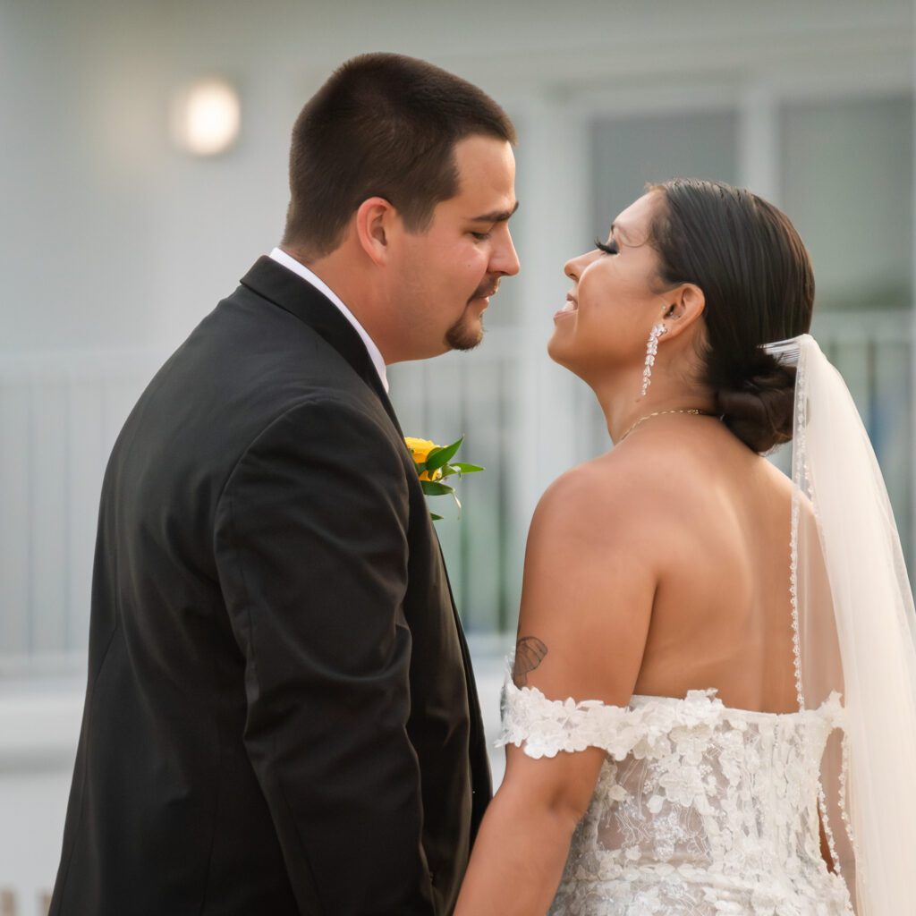 a bride and groom standing close to each other