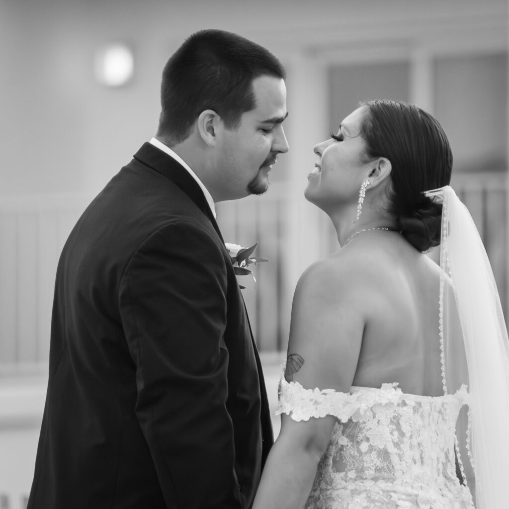 a bride and groom standing close to each other