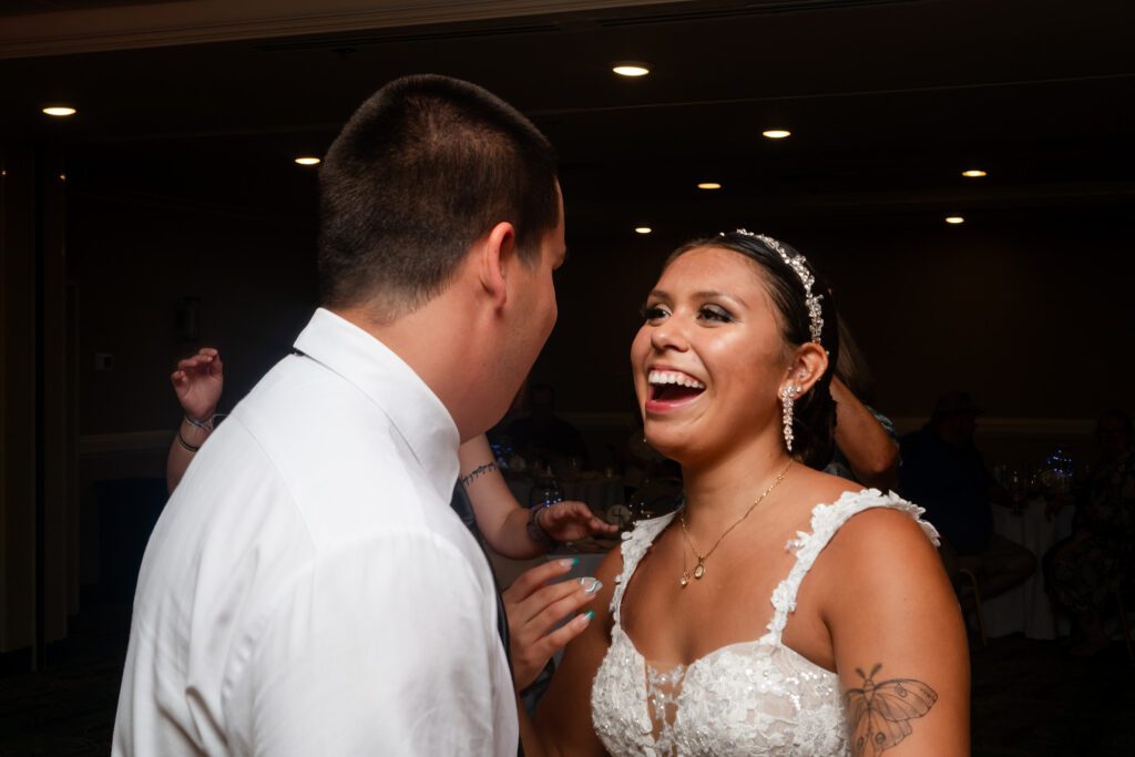 a bride and groom sharing a laugh on their wedding day