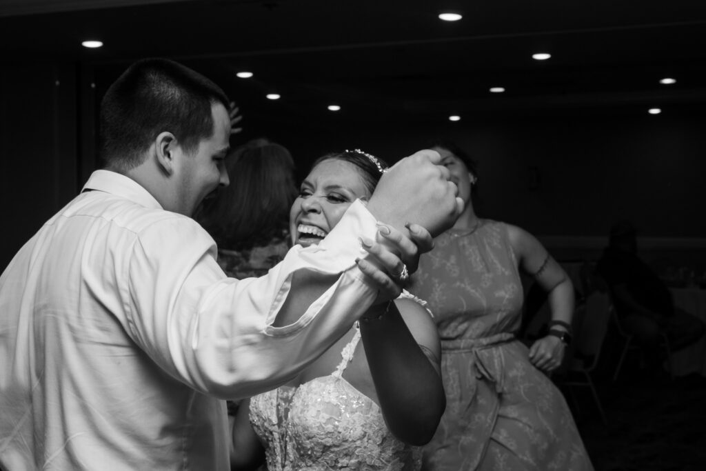 a bride and groom dance together at their wedding reception
