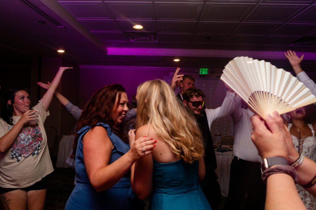 a group of people dancing at a party