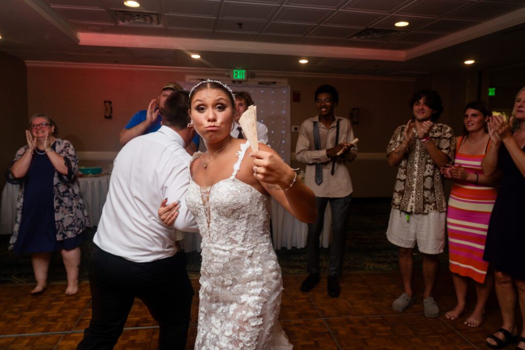 a bride and groom dance on the dance floor