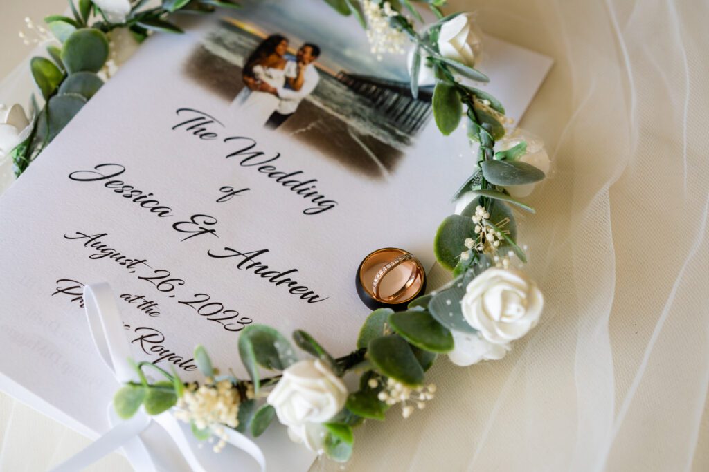 a wedding card with a ring on top of it