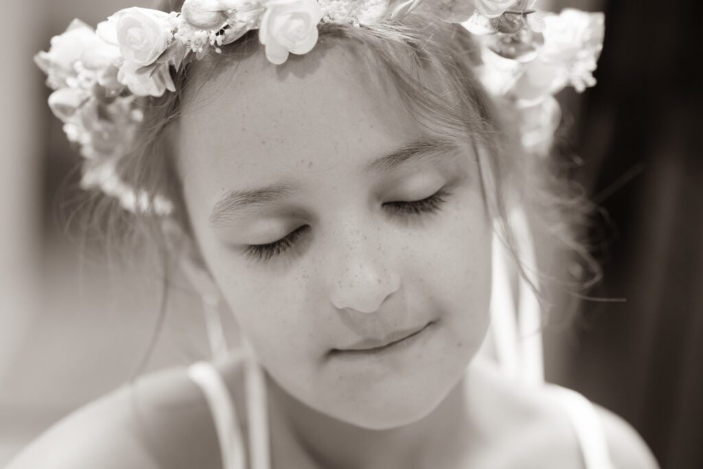 a little girl with a flower crown on her head