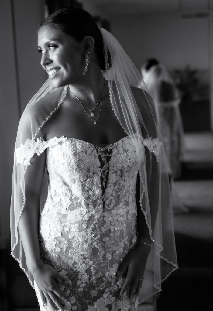 a woman in a wedding dress is smiling