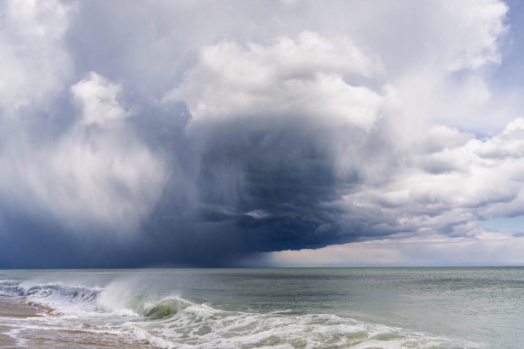 a large storm is coming over the ocean
