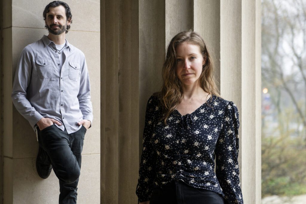 a man and woman standing next to each other