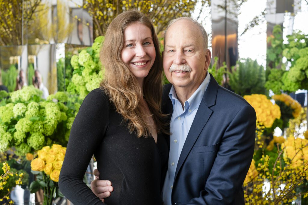 a man and woman standing next to each other