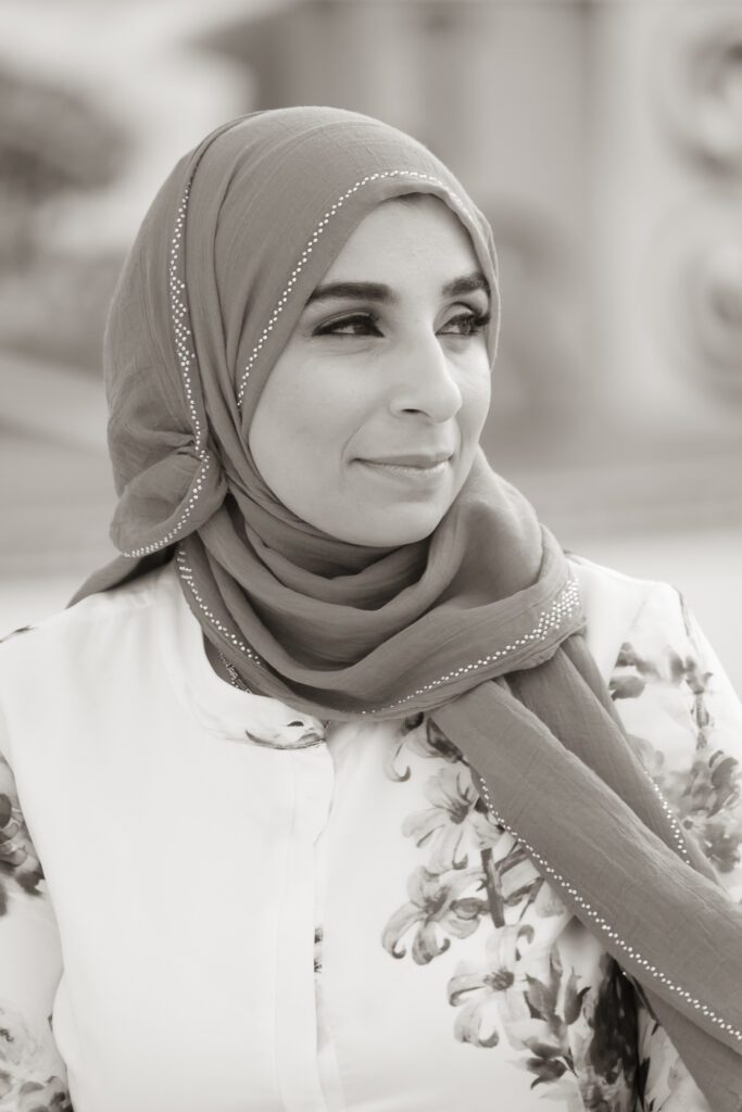 a woman wearing a headscarf and a scarf