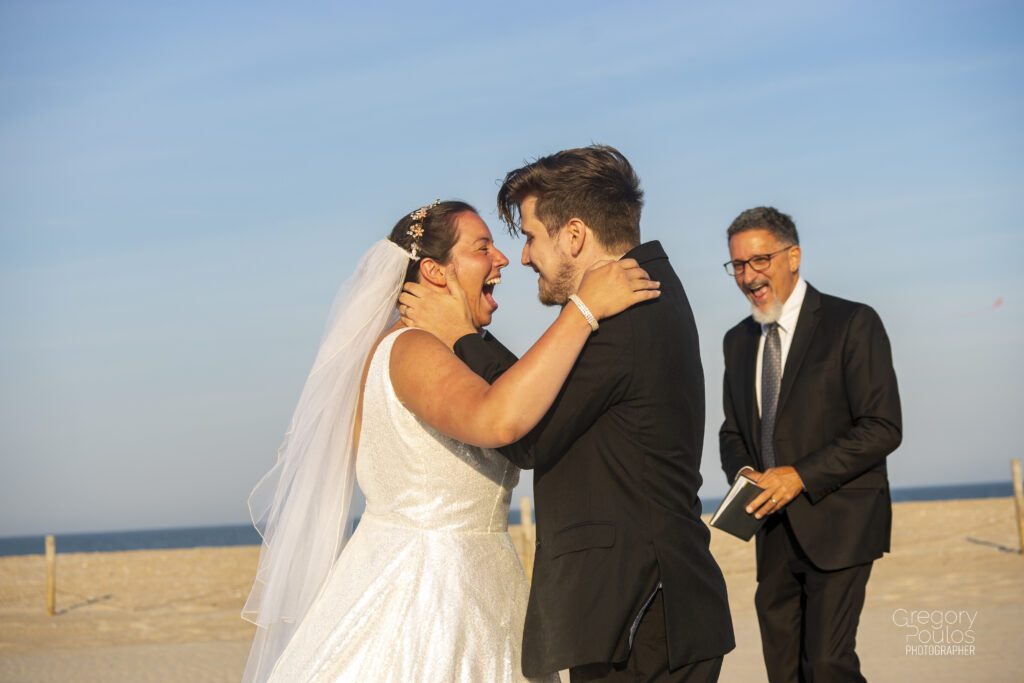 a couple of people that are standing in the sand